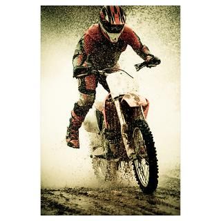 Dirt bike rider splashes through water filled stre Poster