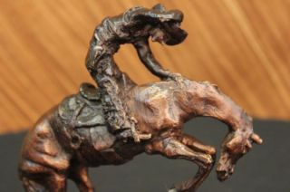 Remington Cowboy on horse batteling a Rattle Snake Bronze Statue