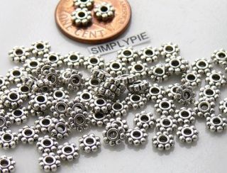 Beautiful antiqued silver metal daisy spacer beads. Please check our