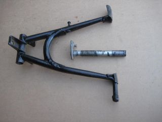You are bidding on one original used center stand with shaft for Honda