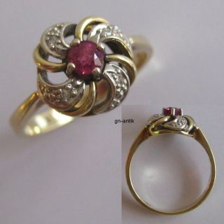 306   Eleganter Ring aus Gold 585 mit Rubin und vier Diamanten